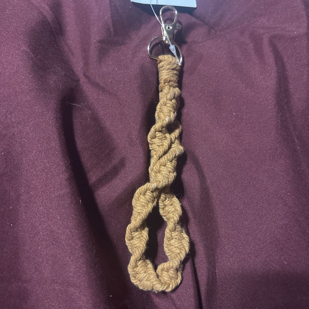 Boutique tan macrame wristlet. Never used, new with tags